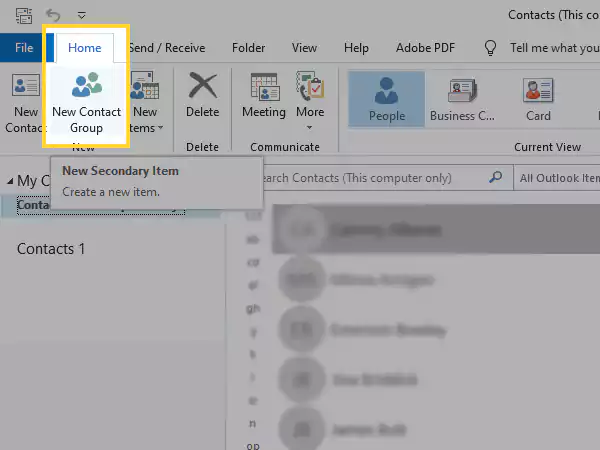 Click on Home and select New Contact Group.